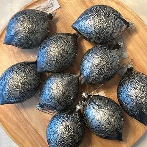 Nine Glass metallic onion ornaments. Unused; 2 still have tags.